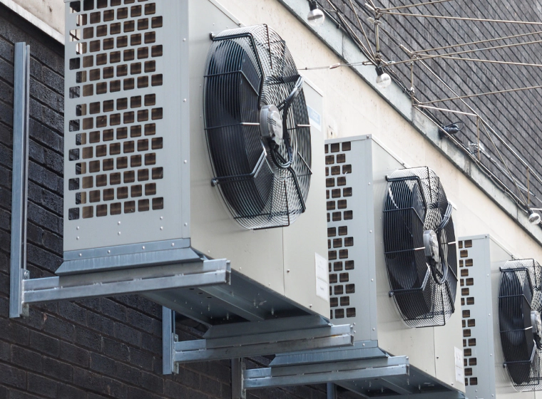 Three ac units on a wall