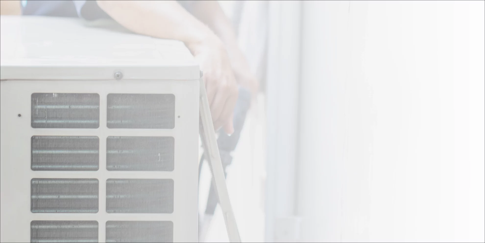 contractor checking the back of an ac unit